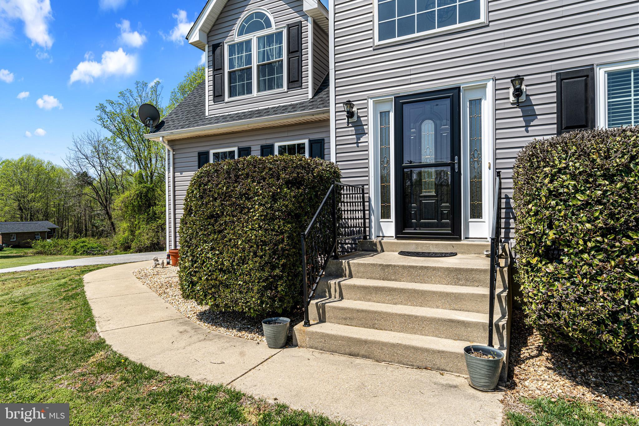 1230 Plum Point Road Huntingtown, MD 20639 - Photo 13 of 79 a view of a house with a yard