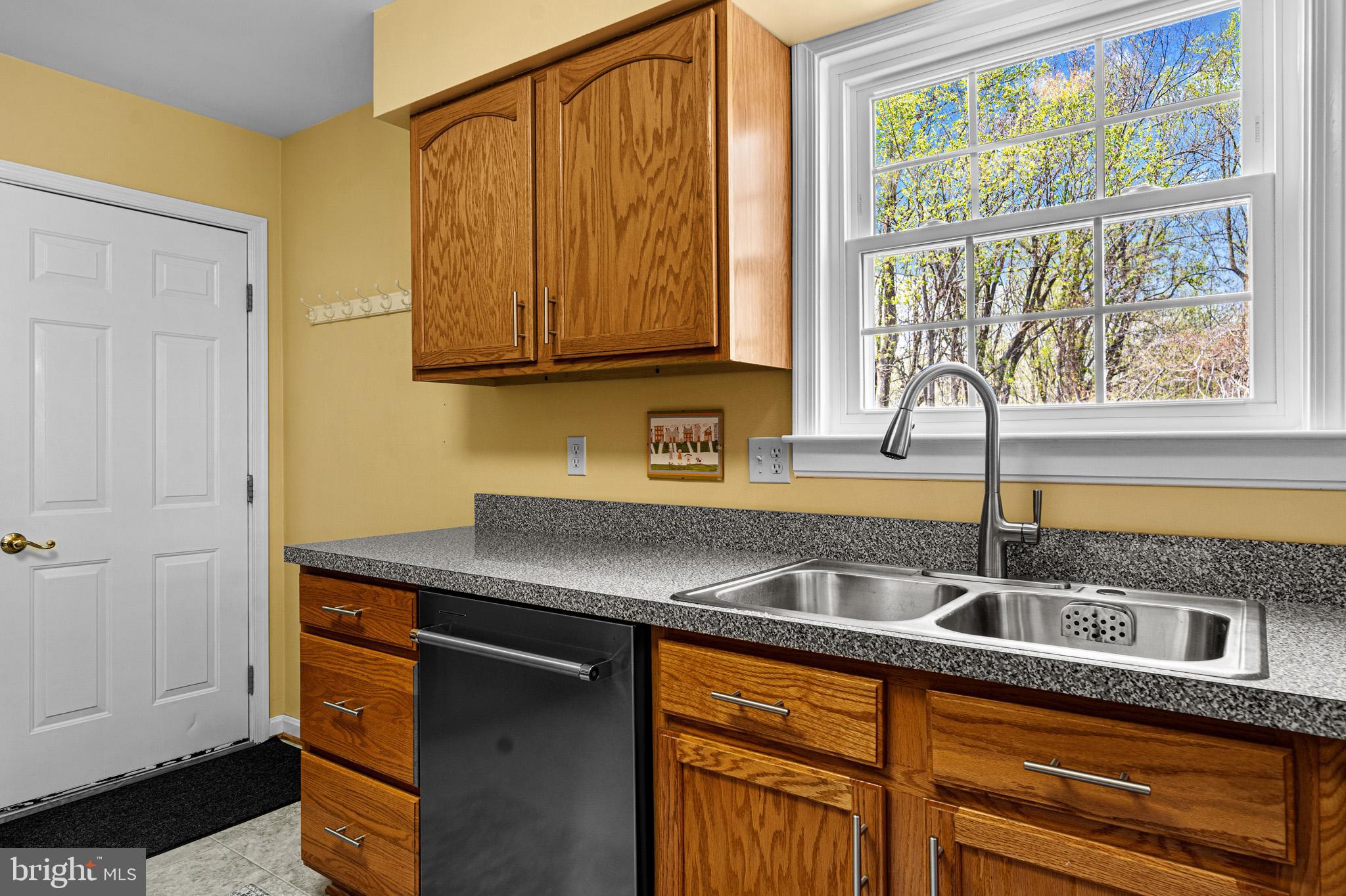 1230 Plum Point Road Huntingtown, MD 20639 - Photo 26 of 79 a kitchen with a sink and a window