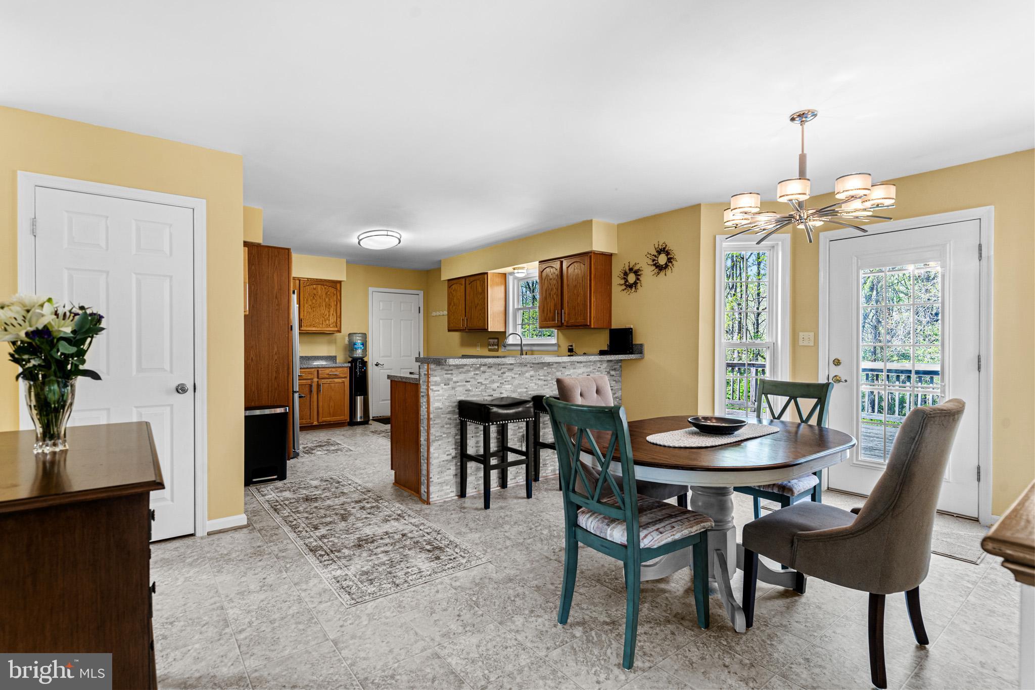 1230 Plum Point Road Huntingtown, MD 20639 - Photo 28 of 79 a view of a dining room with furniture