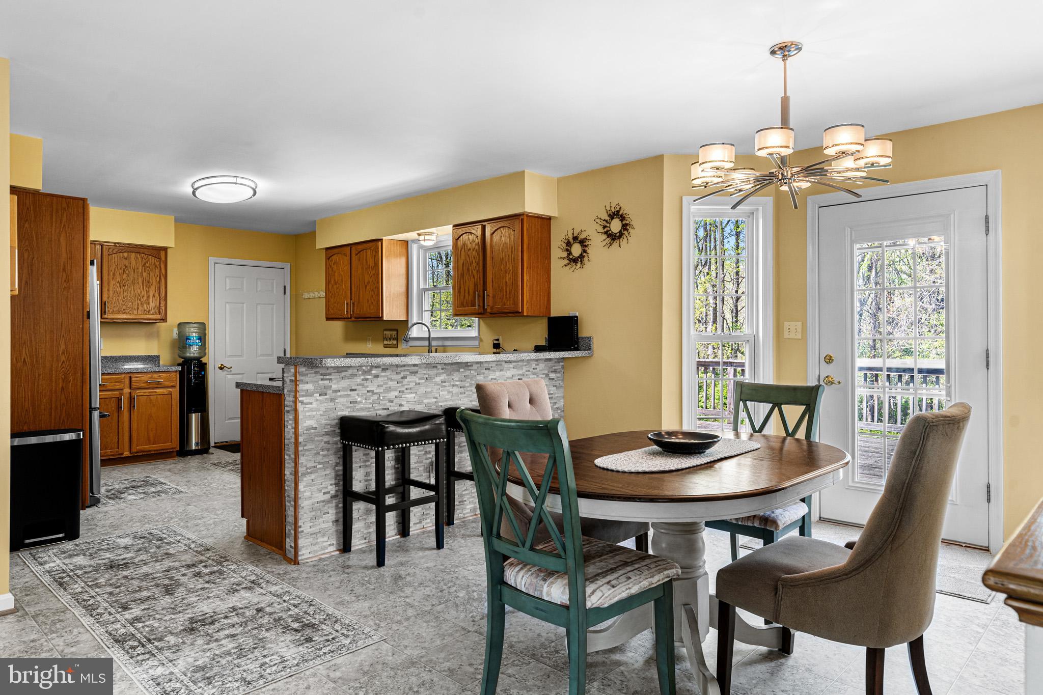 1230 Plum Point Road Huntingtown, MD 20639 - Photo 29 of 79 a view of a dining room with furniture window and wooden floor