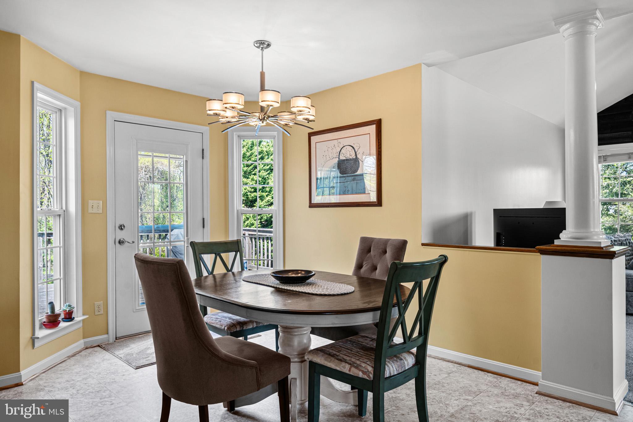 1230 Plum Point Road Huntingtown, MD 20639 - Photo 31 of 79 a view of a dining room with furniture window and outside view