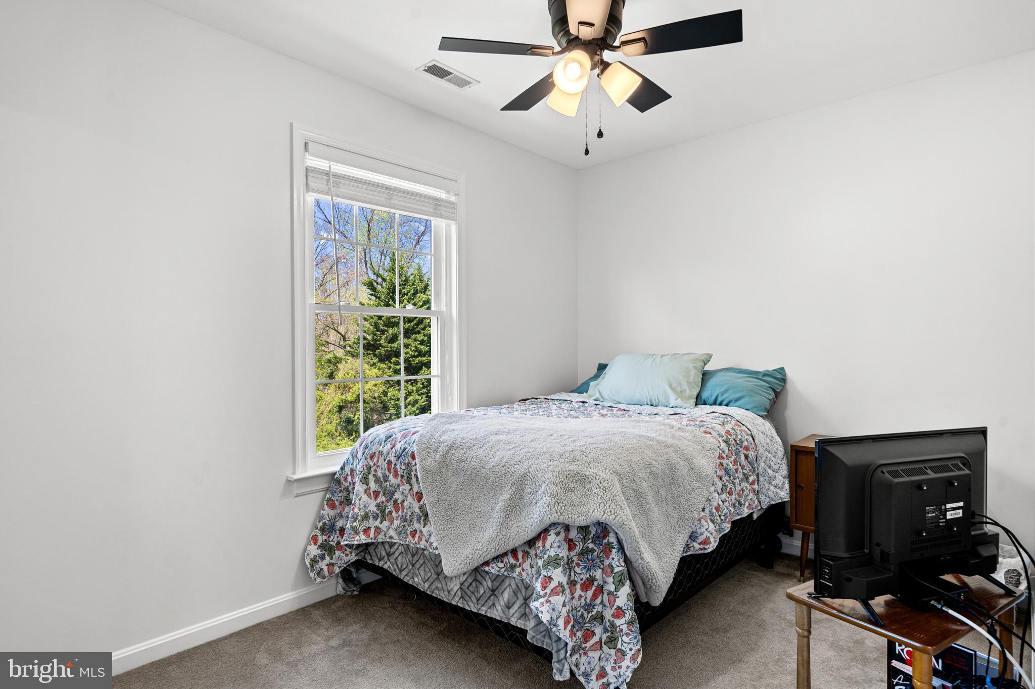 1230 Plum Point Road Huntingtown, MD 20639 - Photo 41 of 79 a bedroom with a bed and a window