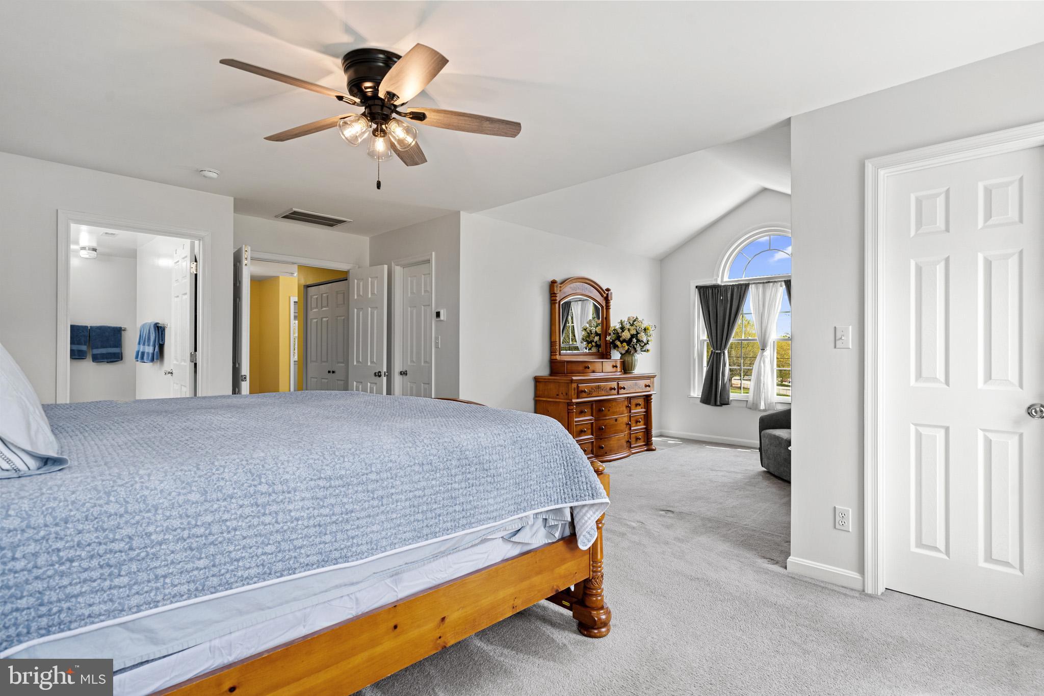 1230 Plum Point Road Huntingtown, MD 20639 - Photo 46 of 79 a bedroom with bed and a chandelier