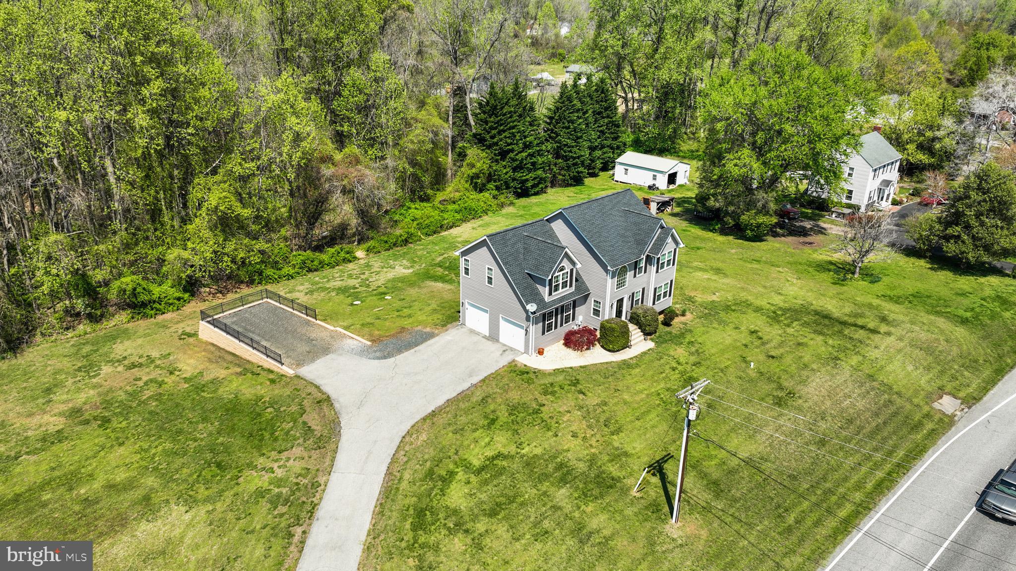 1230 Plum Point Road Huntingtown, MD 20639 - Photo 56 of 79 a view of a backyard with chairs