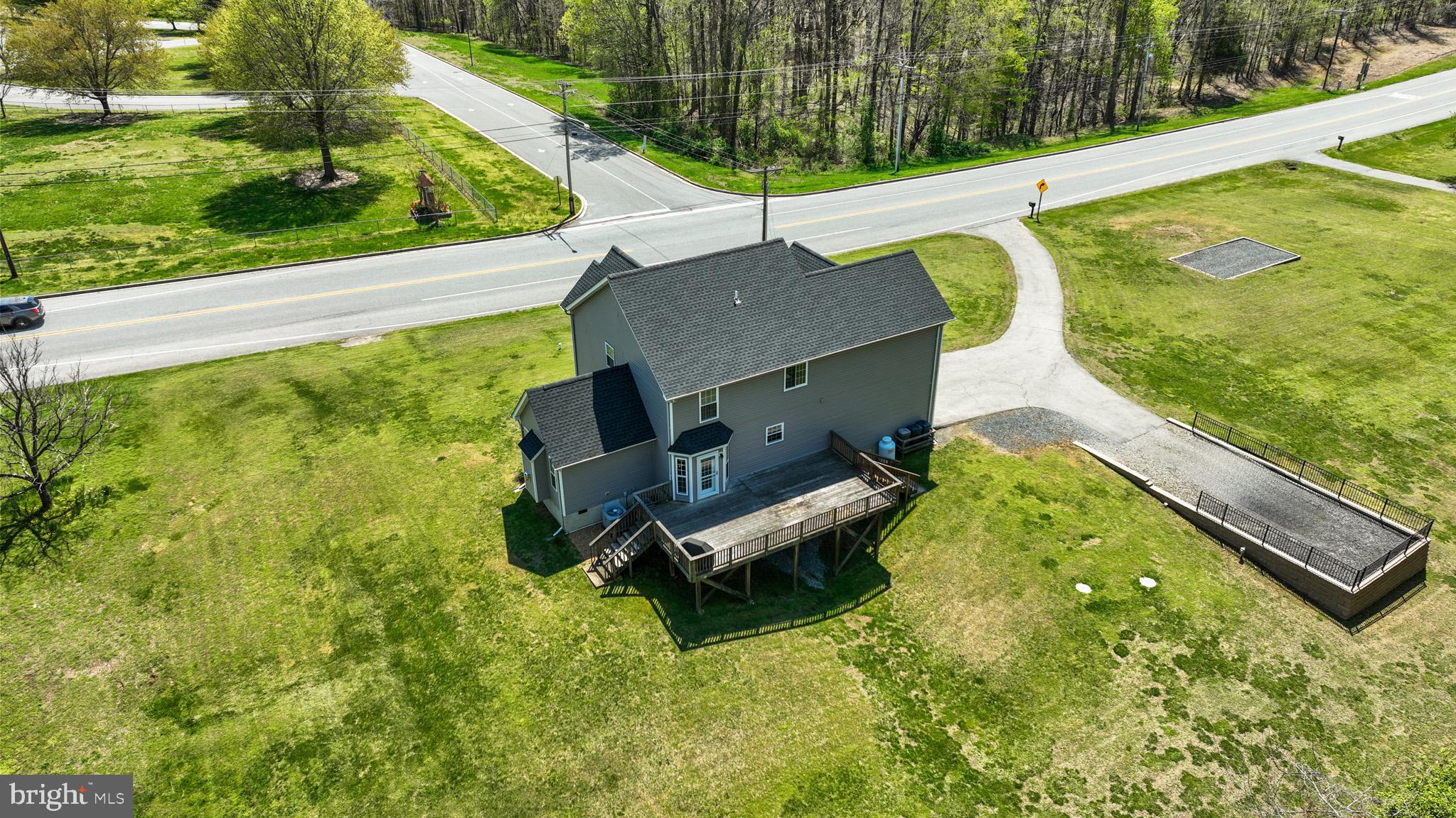 1230 Plum Point Road Huntingtown, MD 20639 - Photo 57 of 79 a garden view with a swimming pool
