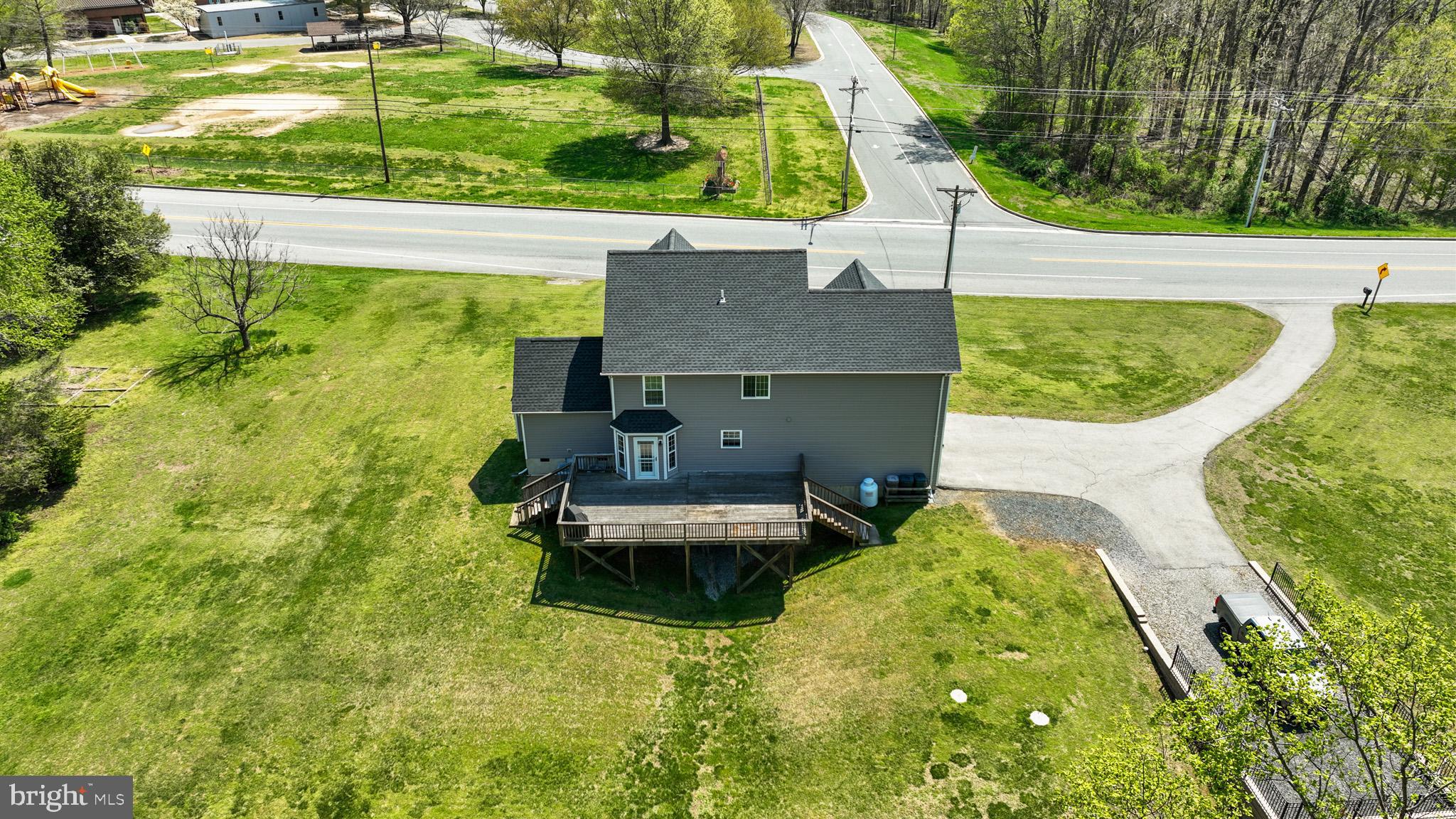 1230 Plum Point Road Huntingtown, MD 20639 - Photo 58 of 79 a aerial view of a house with swimming pool and large trees