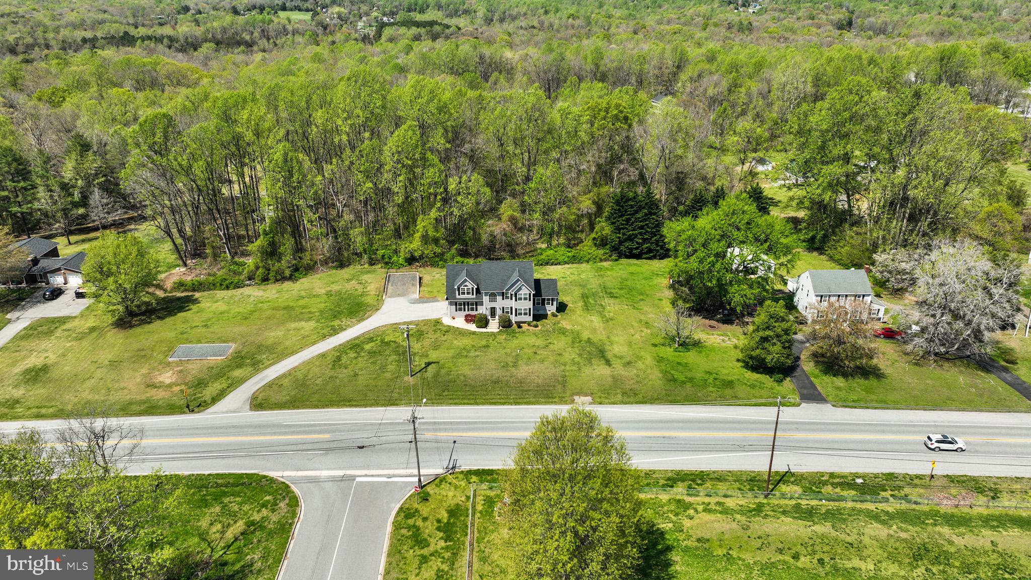 1230 Plum Point Road Huntingtown, MD 20639 - Photo 61 of 79 a view of a yard with an outdoor space