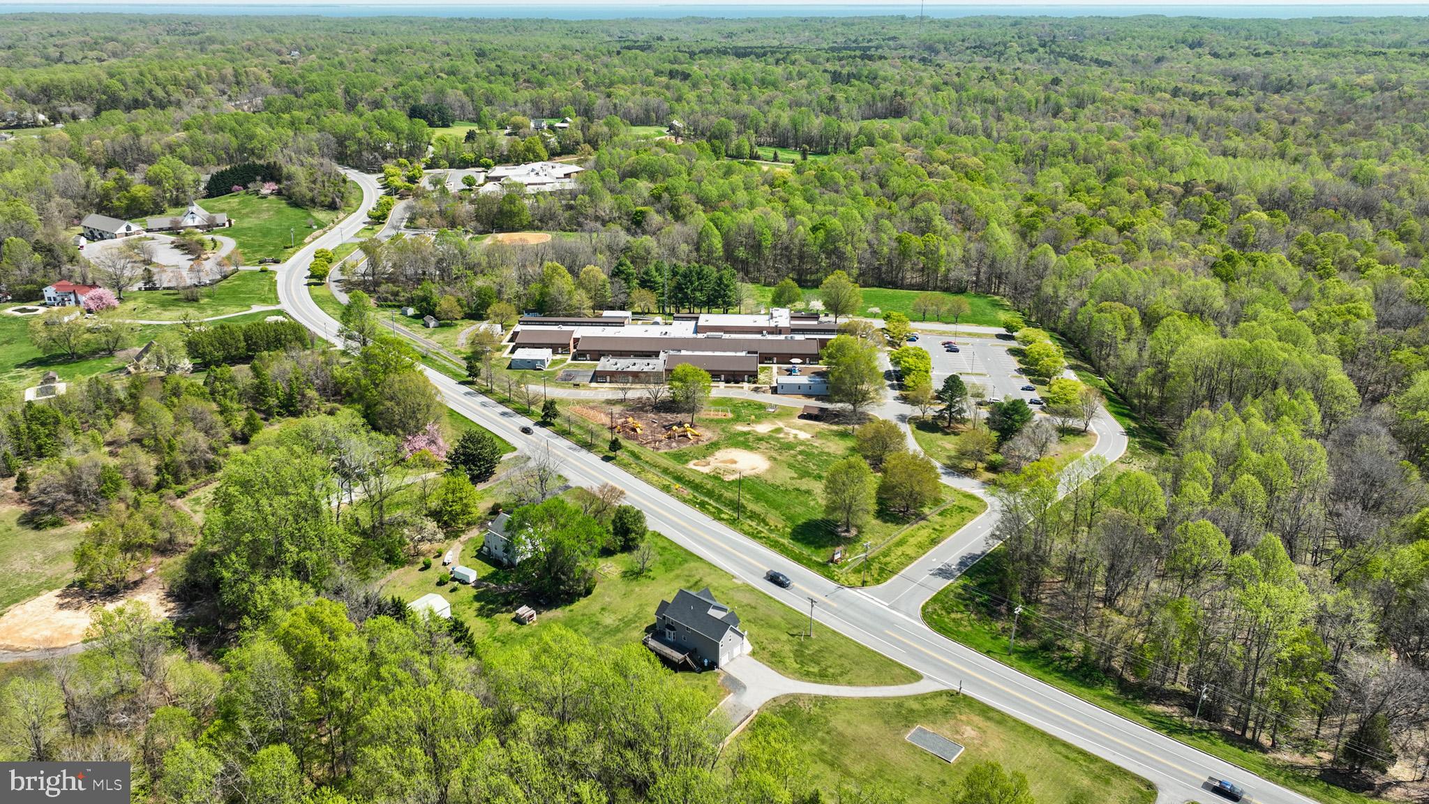 1230 Plum Point Road Huntingtown, MD 20639 - Photo 63 of 79 an aerial view of residential houses with outdoor space and trees