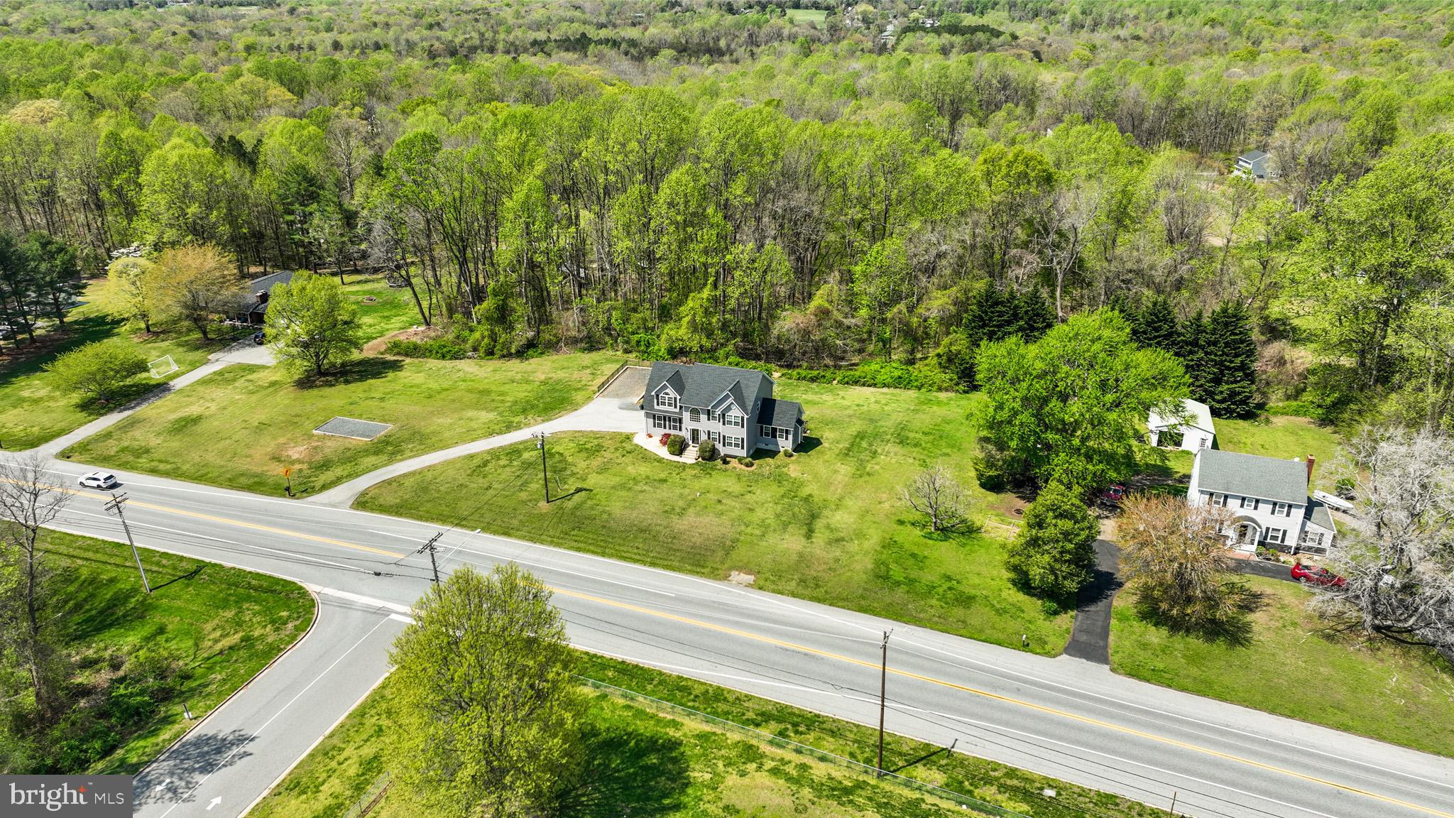 1230 Plum Point Road Huntingtown, MD 20639 - Photo 66 of 79 a view of a garden with a bench