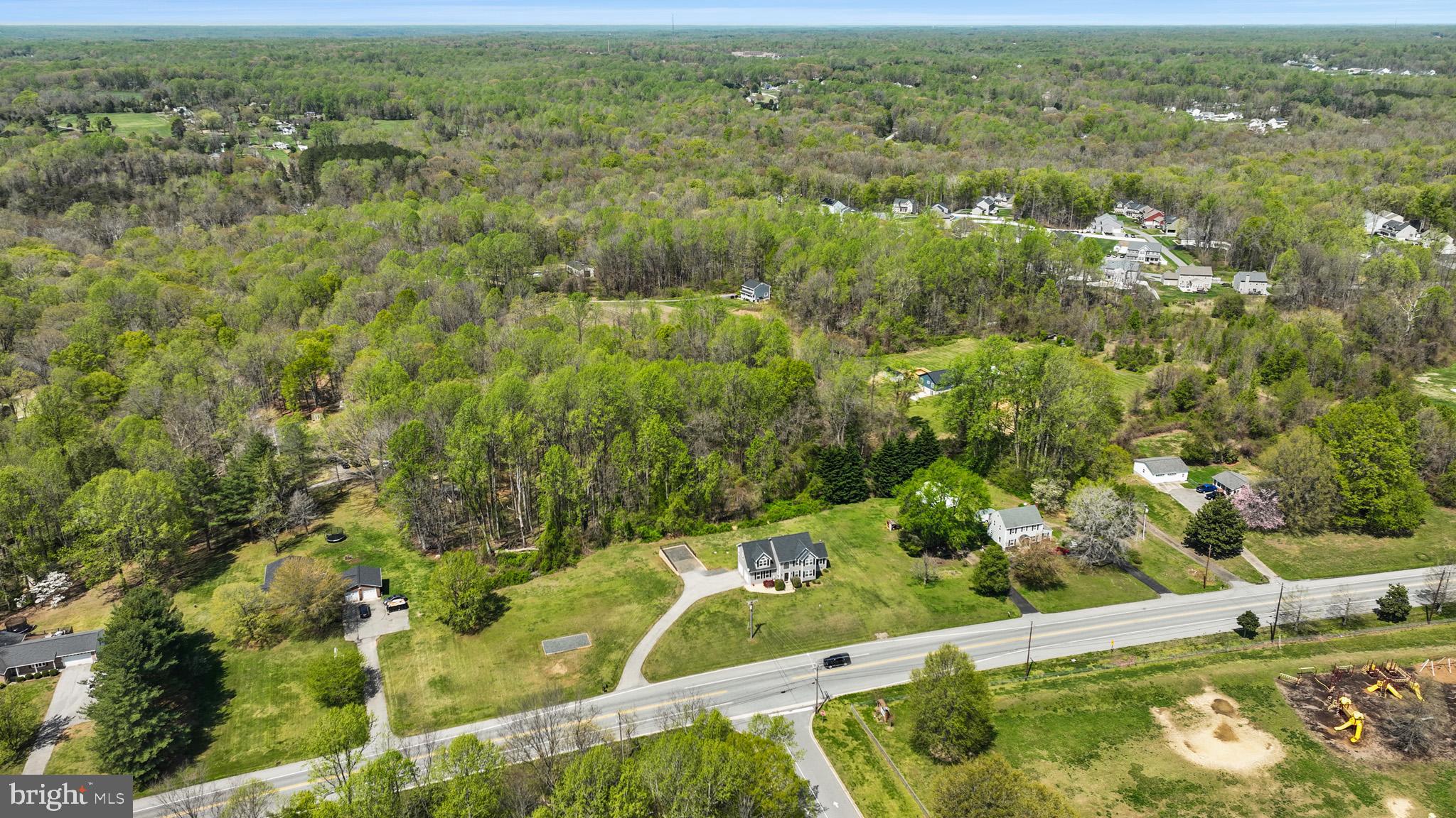 1230 Plum Point Road Huntingtown, MD 20639 - Photo 67 of 79 an aerial view of residential houses with outdoor space and trees