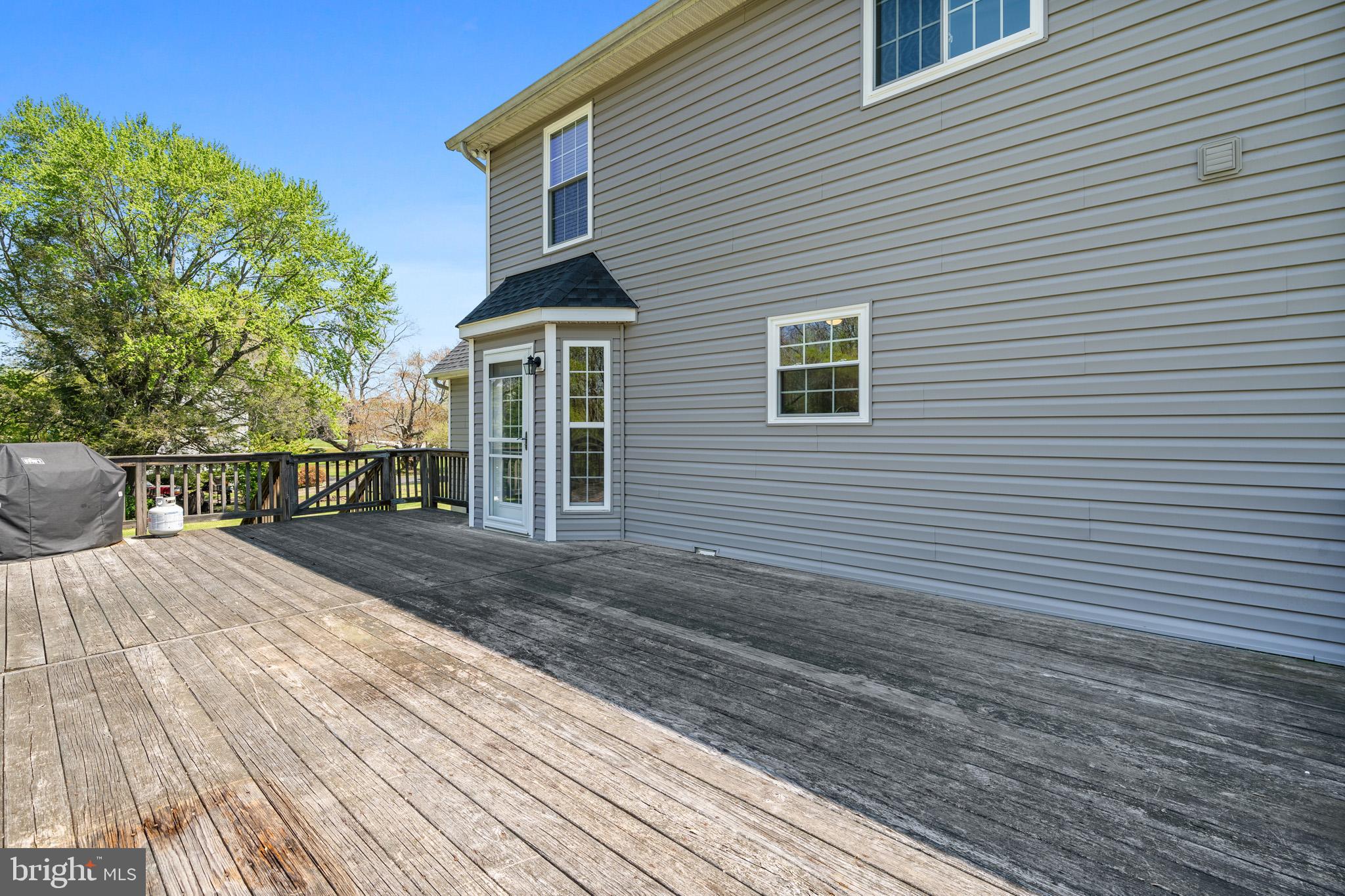1230 Plum Point Road Huntingtown, MD 20639 - Photo 68 of 79 a view of a house with a yard and sitting area