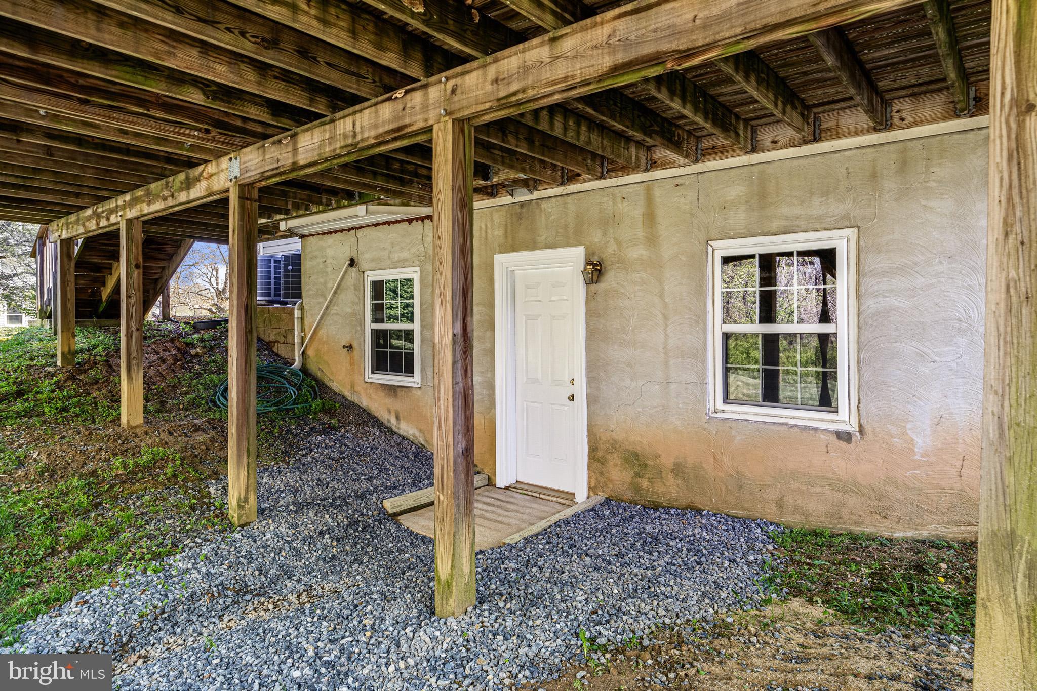 1230 Plum Point Road Huntingtown, MD 20639 - Photo 69 of 79 a front view of a house with a porch