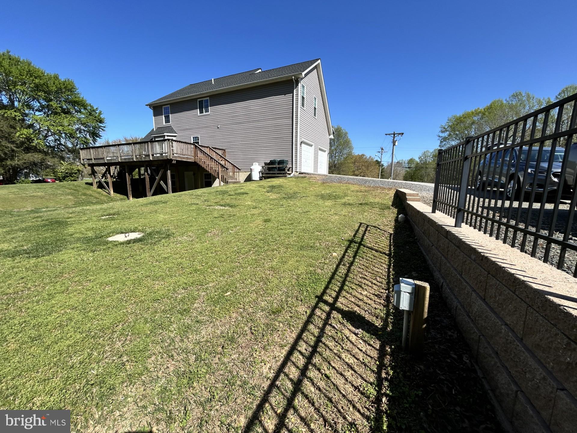 1230 Plum Point Road Huntingtown, MD 20639 - Photo 73 of 79 a view of a roof deck with a wooden fence