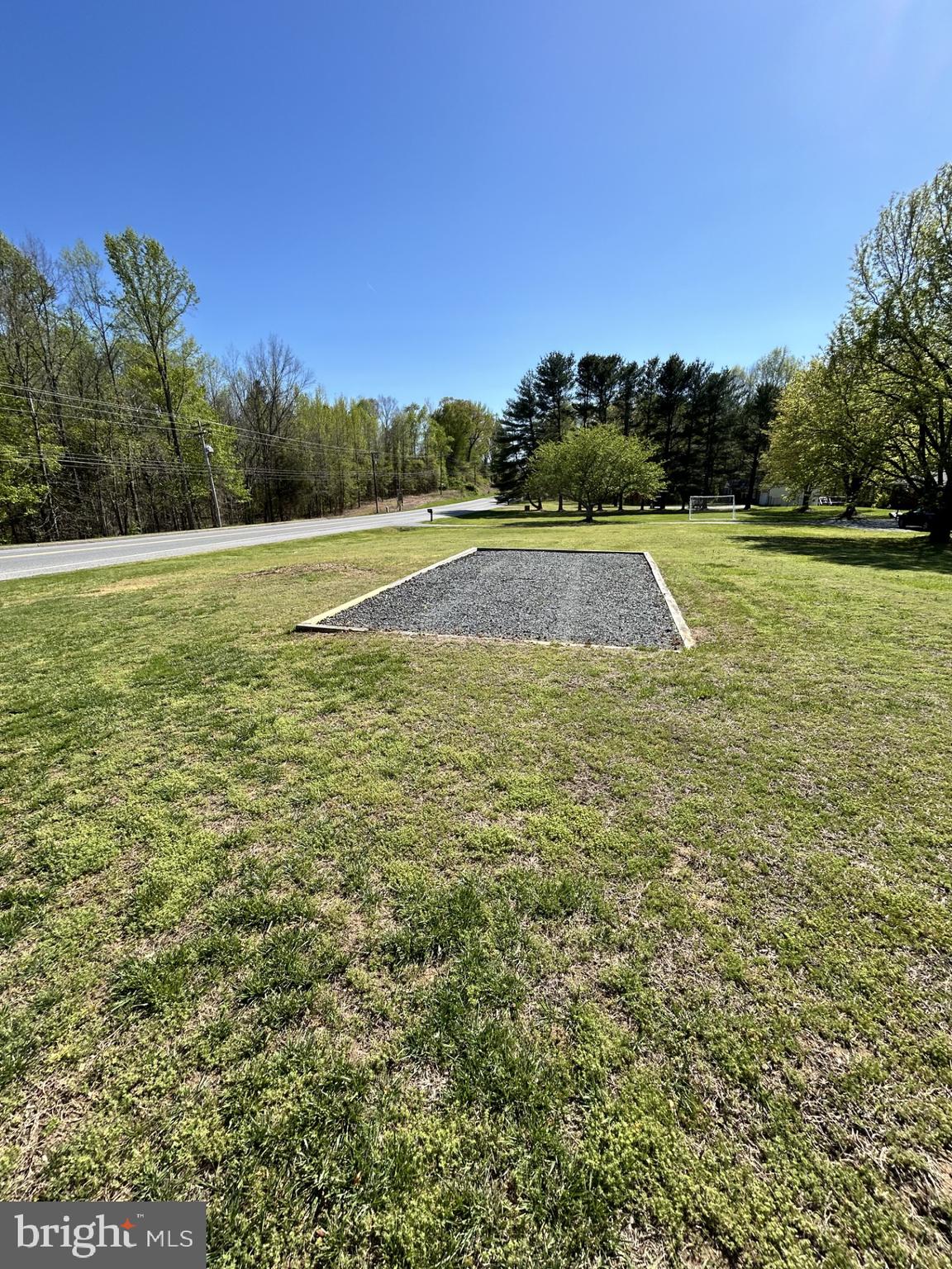 1230 Plum Point Road Huntingtown, MD 20639 - Photo 76 of 79 a view of a swimming pool with a yard