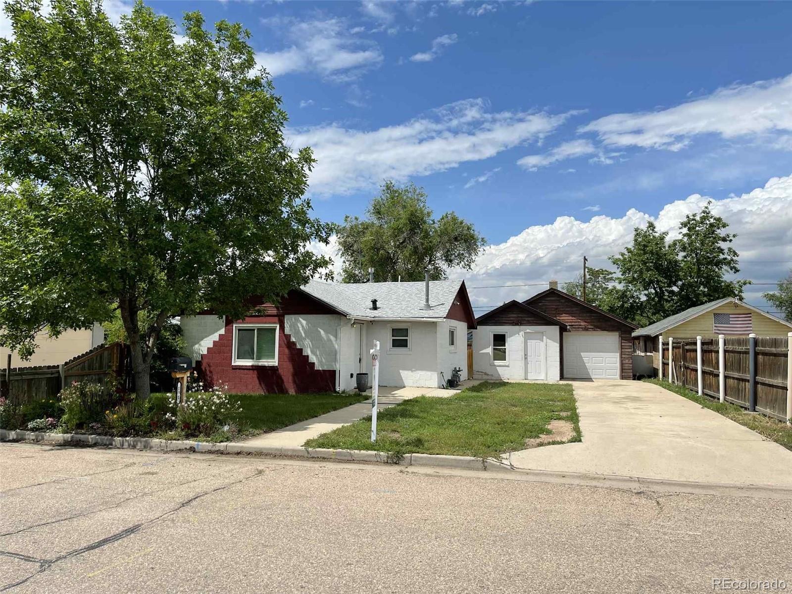 131 2nd Street Fort Lupton, CO 80621 - Photo 1 of 1 front view of house with a yard