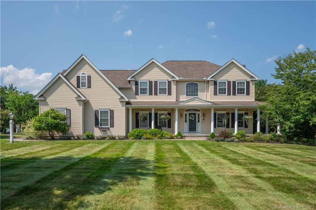 a front view of a house with a yard