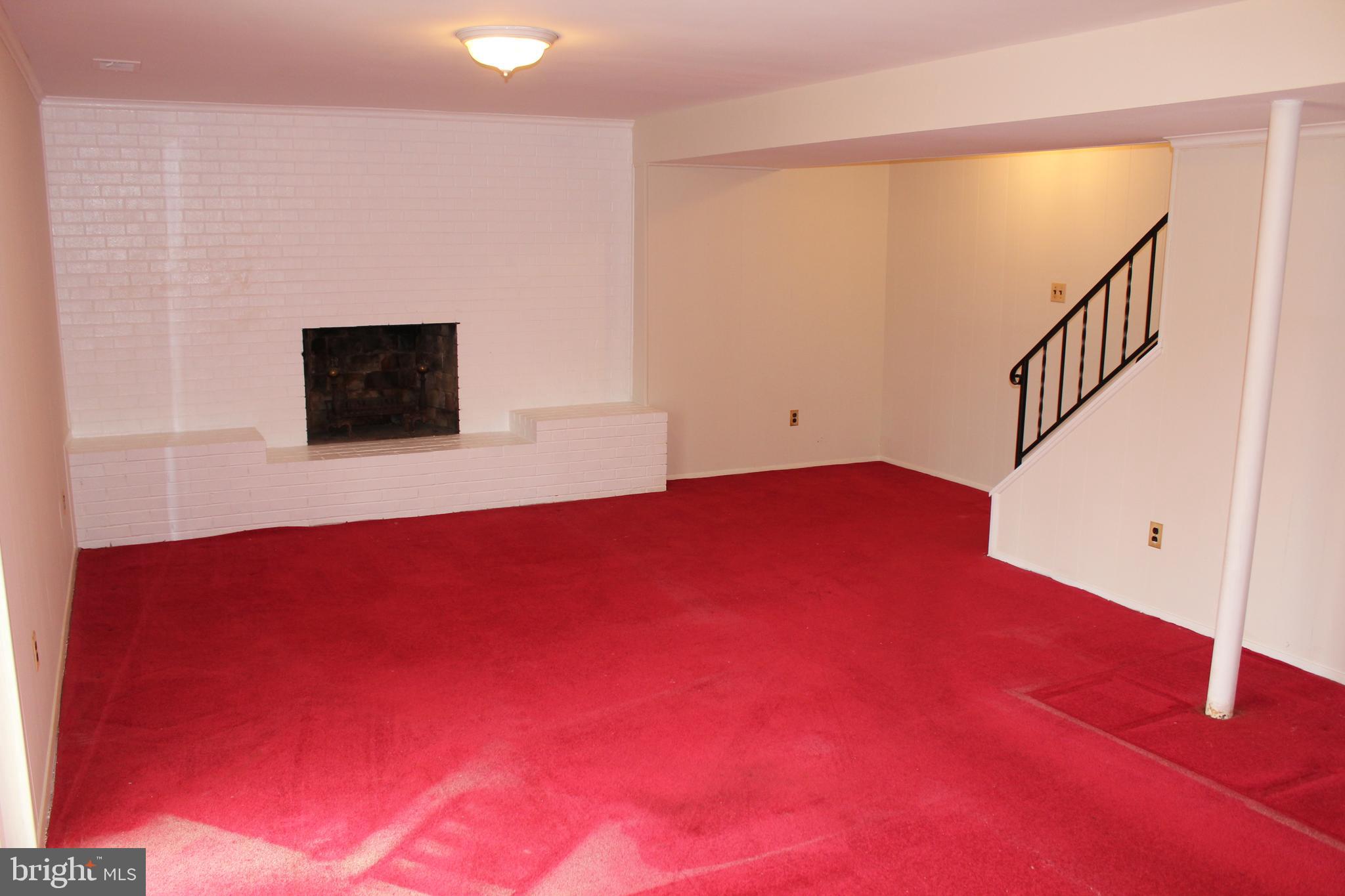 8218 Dabney Avenue Springfield, VA 22152 - Photo 21 of 33 Rec Room with Brick Fireplace