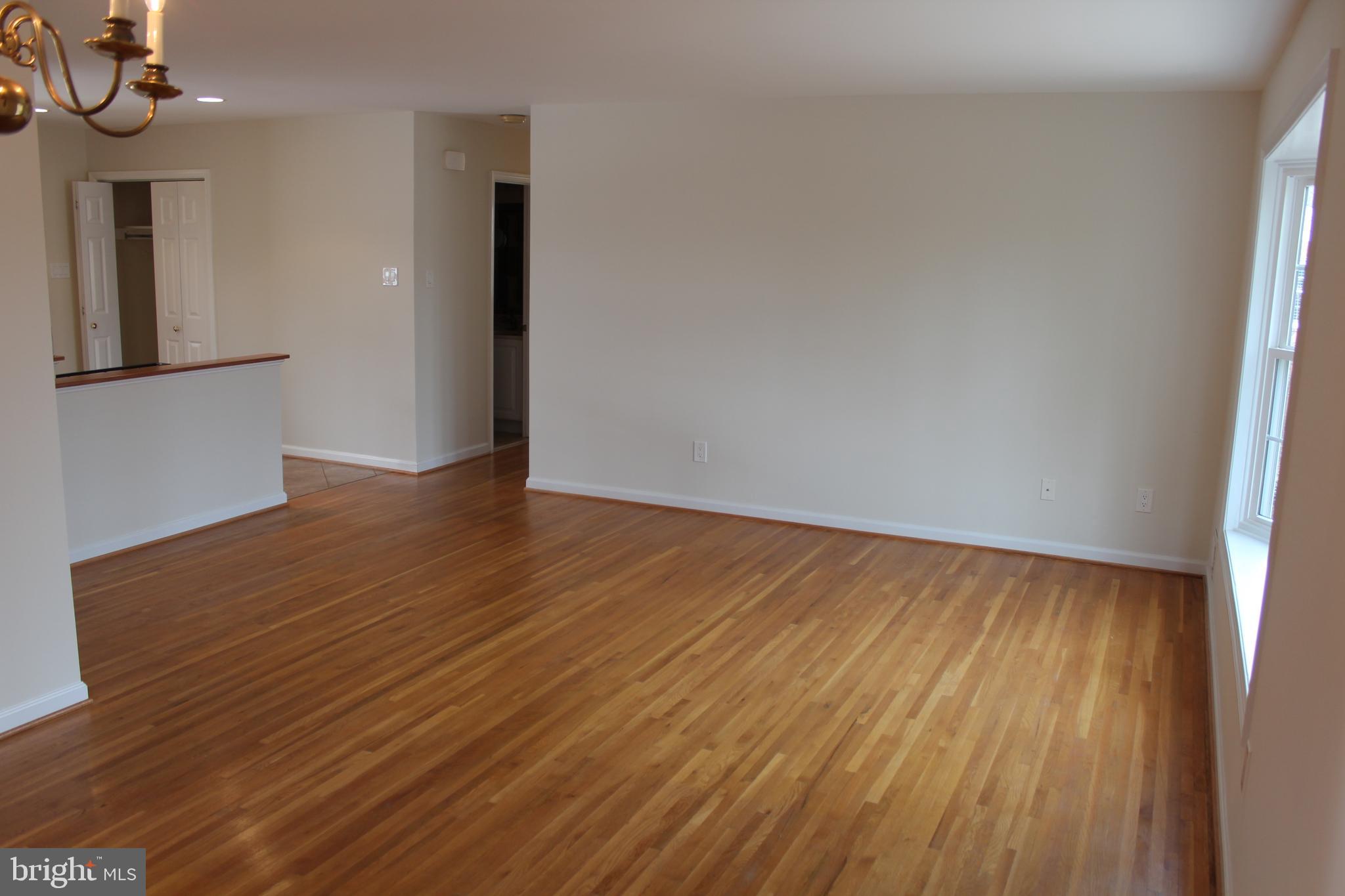 8218 Dabney Avenue Springfield, VA 22152 - Photo 9 of 33 Living Room - hardwood floors, seen from DR