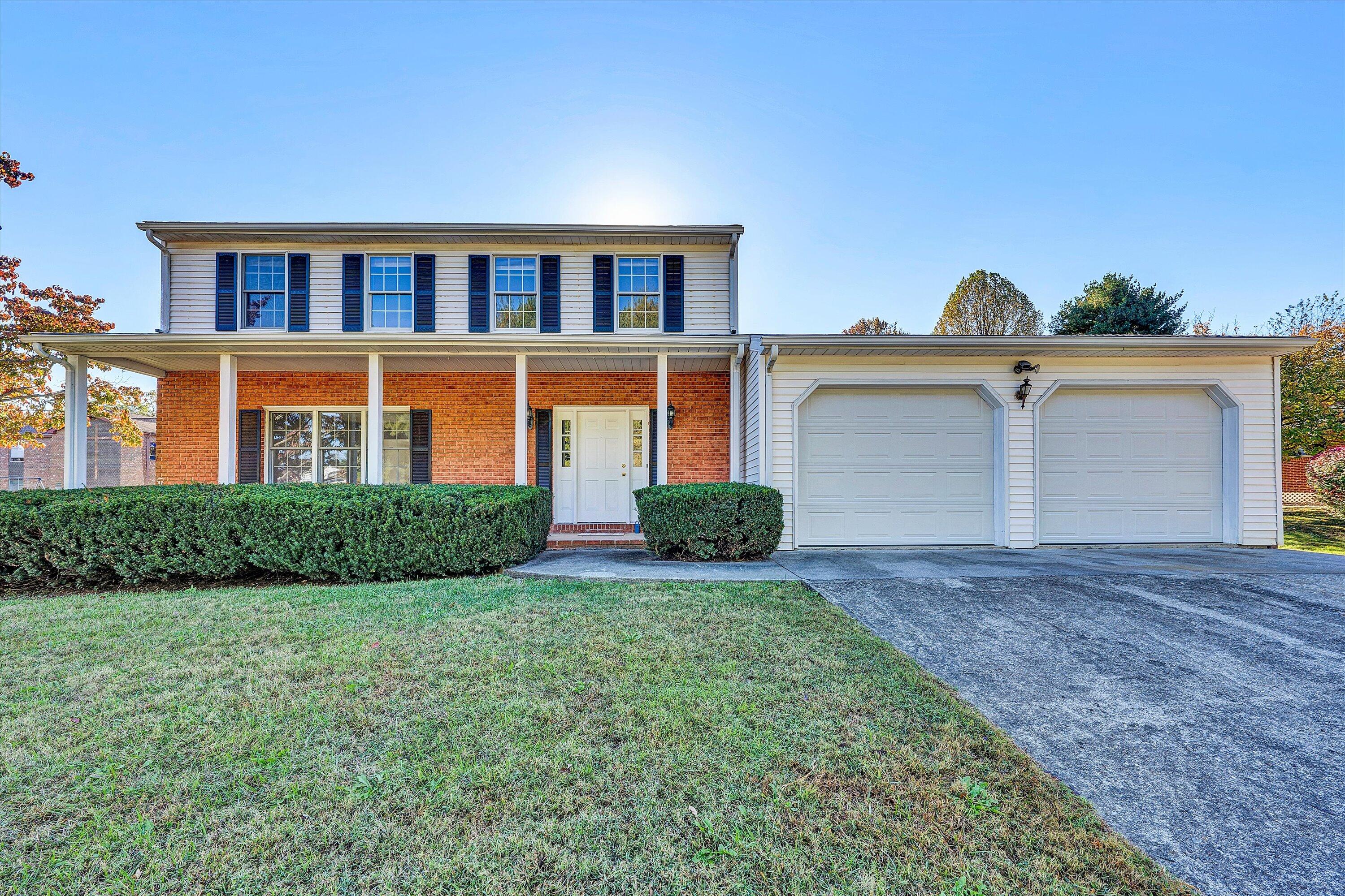 a view of a yard in front of a house