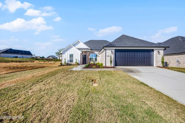 a house with swimming pool in front of it