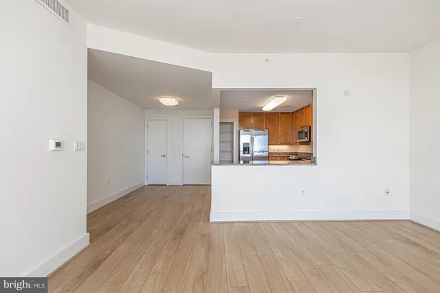 a view of a kitchen with wooden floor