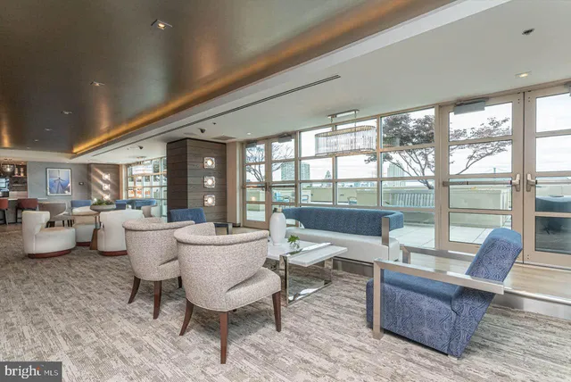 a view of a dining room with furniture wooden floor and chandelier