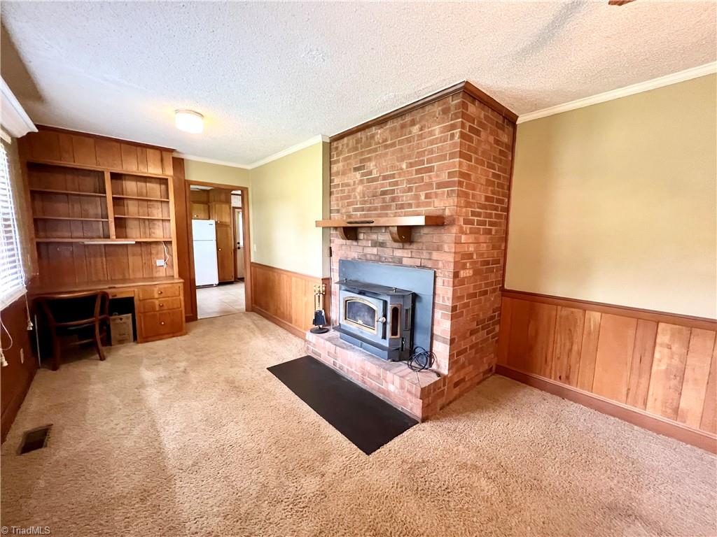 3684 Oak Ridge Road Summerfield, NC 27358 - Photo 12 of 42 Den also has an office area with bookshelves.
