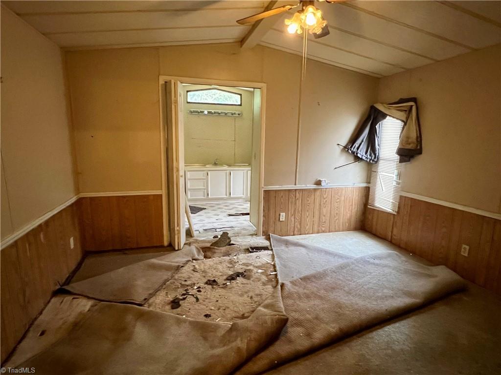 3684 Oak Ridge Road Summerfield, NC 27358 - Photo 33 of 42 Mobile home primary bedroom has a hole in the floor