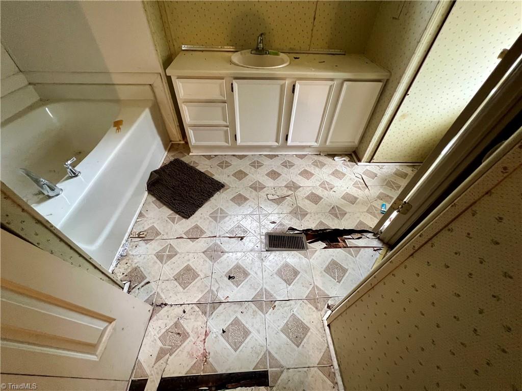 3684 Oak Ridge Road Summerfield, NC 27358 - Photo 35 of 42 View of primary bath floor damage