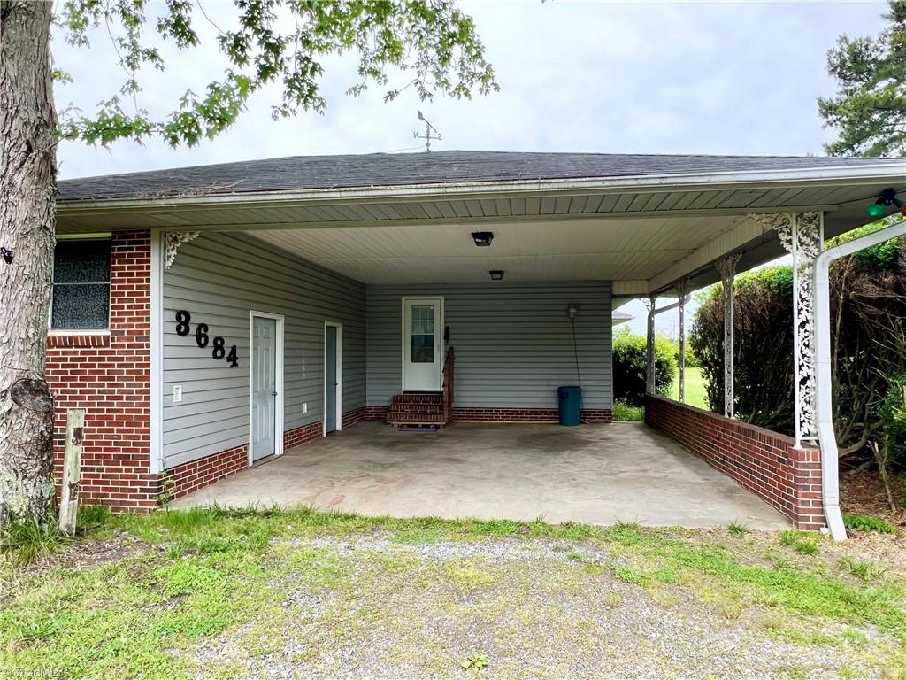 3684 Oak Ridge Road Summerfield, NC 27358 - Photo 4 of 42 Attached carport with 2 outdoor utility/storage rooms