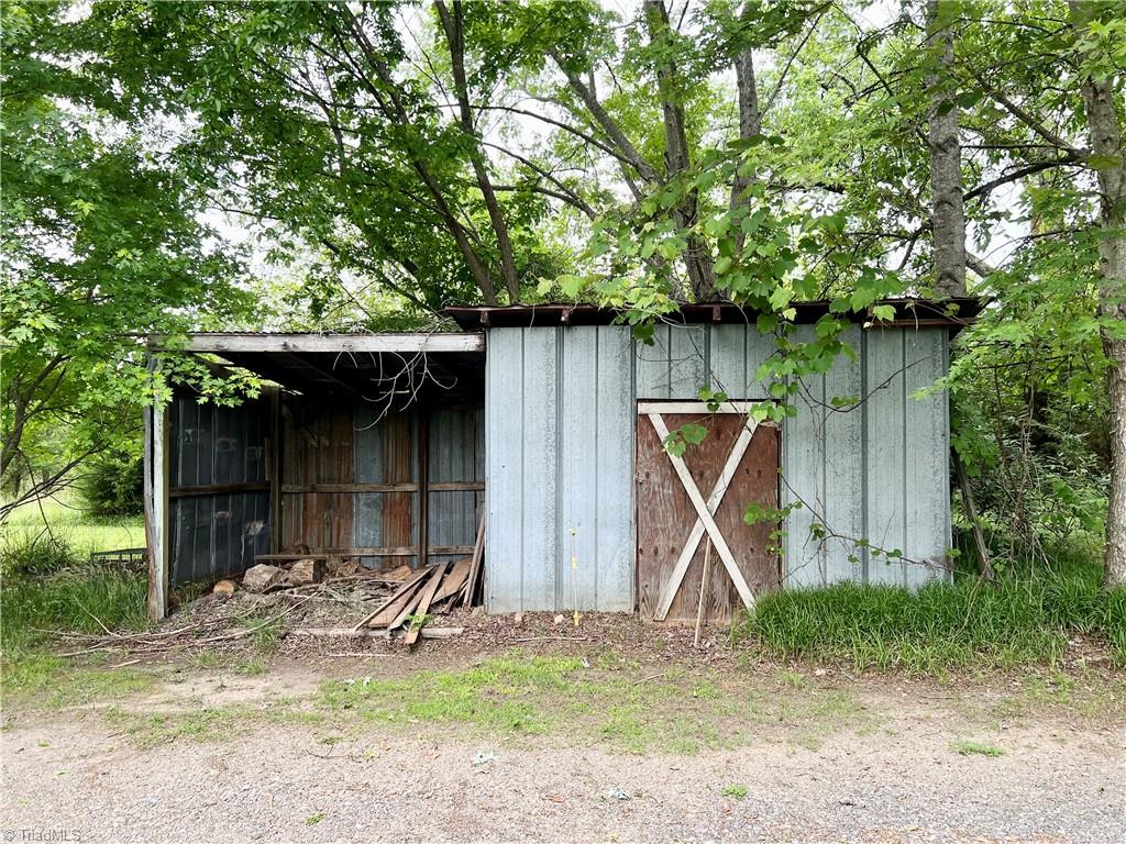 3684 Oak Ridge Road Summerfield, NC 27358 - Photo 42 of 42 Storage building with lawnmower shed