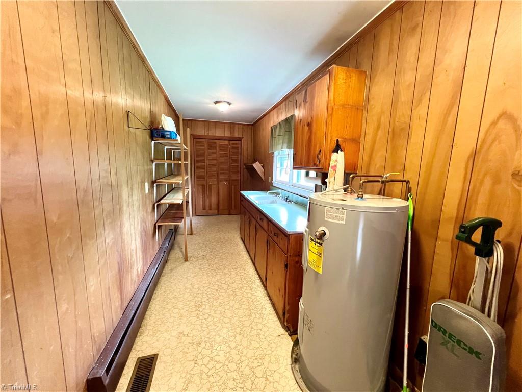 3684 Oak Ridge Road Summerfield, NC 27358 - Photo 10 of 42 Utility room with full kitchen style sink, built in shelving, pantry area, and washer/dryer hookup
