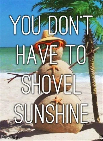 a view of a swimming pool with a yard