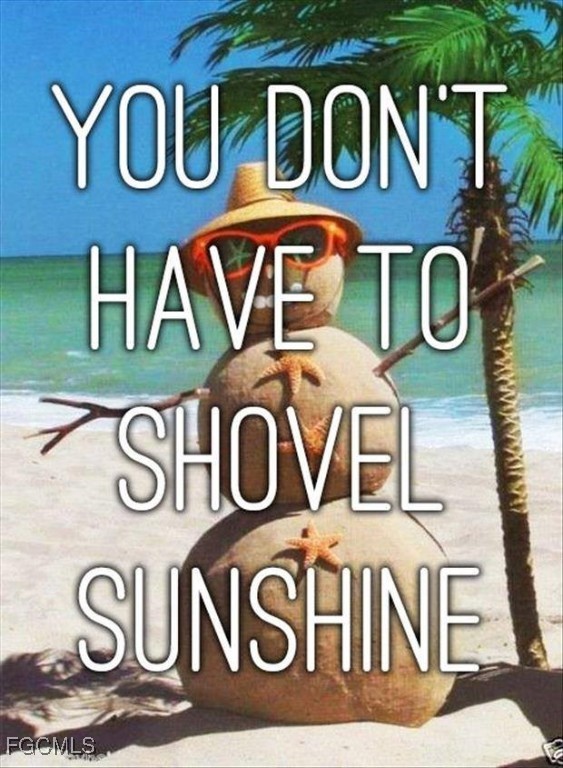 13781 Driftwood Road Bokeelia, FL 33922 - Photo 12 of 13 a front view of a brick building with many windows