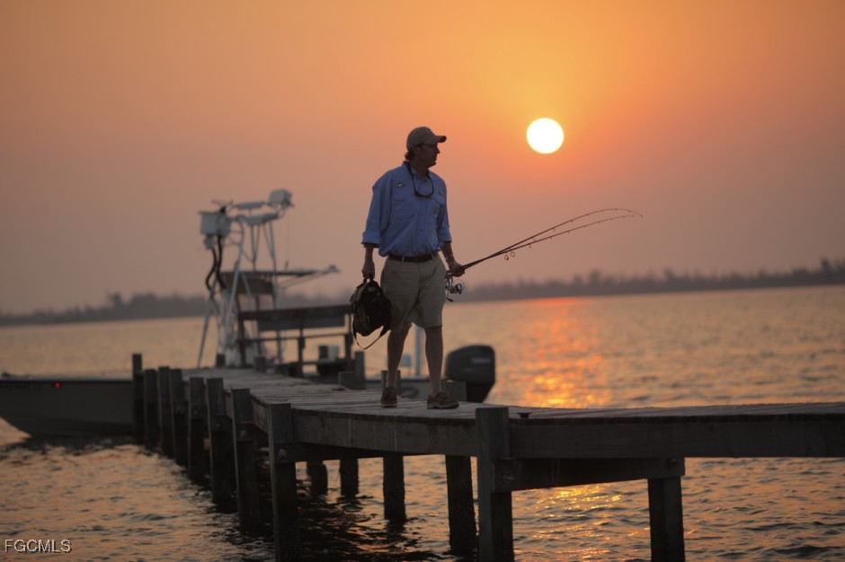 13781 Driftwood Road Bokeelia, FL 33922 - Photo 4 of 13 a view of a lake from balcony