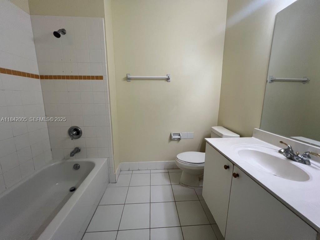 23712 Southwest 110th Avenue Homestead, FL 33032 - Photo 16 of 41 a bathroom with a sink a toilet and shower