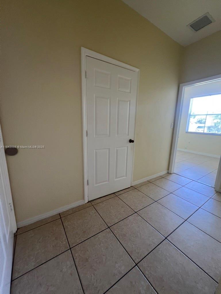 23712 Southwest 110th Avenue Homestead, FL 33032 - Photo 18 of 41 a view of an empty room and window