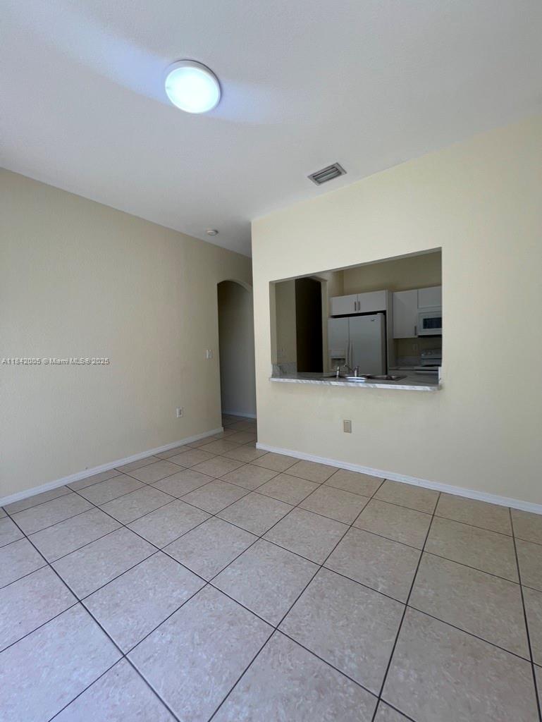 23712 Southwest 110th Avenue Homestead, FL 33032 - Photo 22 of 41 a view of a livingroom with a dishwasher and cabinets