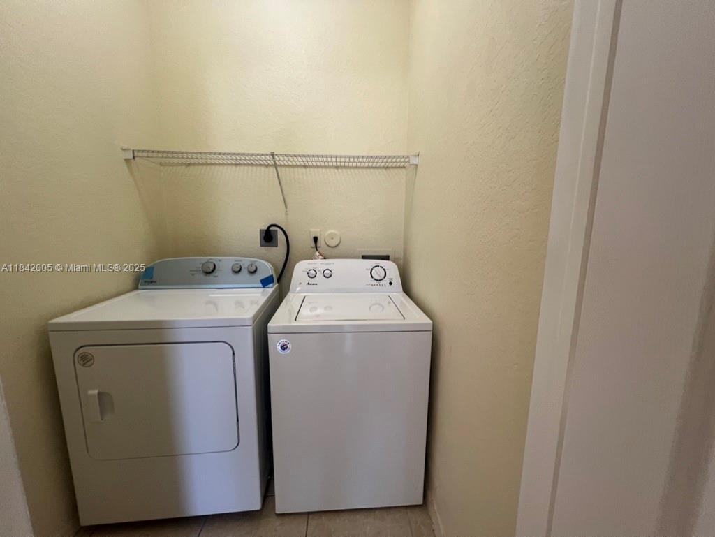 23712 Southwest 110th Avenue Homestead, FL 33032 - Photo 26 of 41 a utility room with dryer and washer