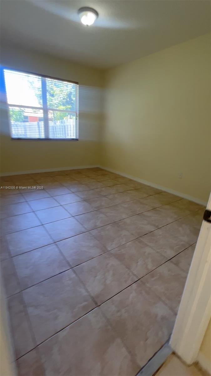 23712 Southwest 110th Avenue Homestead, FL 33032 - Photo 35 of 41 an empty room with windows