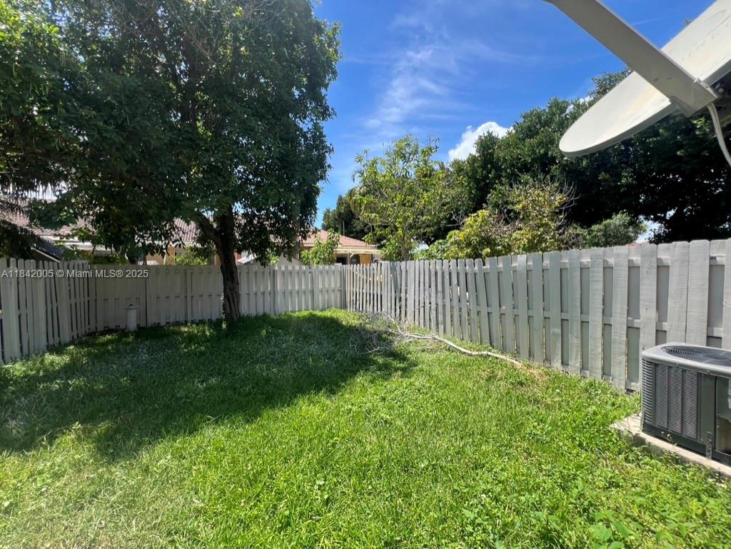 23712 Southwest 110th Avenue Homestead, FL 33032 - Photo 40 of 41 a view of a backyard with a trees