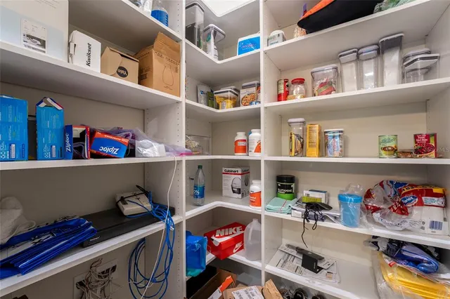 a view of a livingroom with furniture wooden floor and staircase