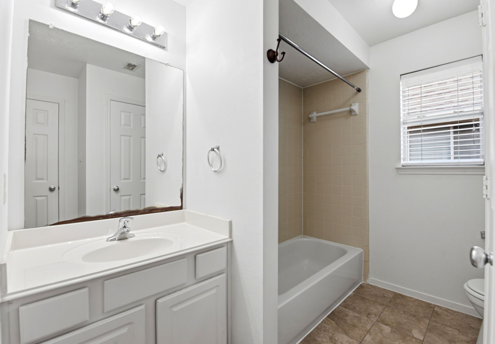 22102 Bridgestone Crossing Drive Spring, TX 77388 - Photo 32 of 38 a bathroom with a sink a toilet and shower