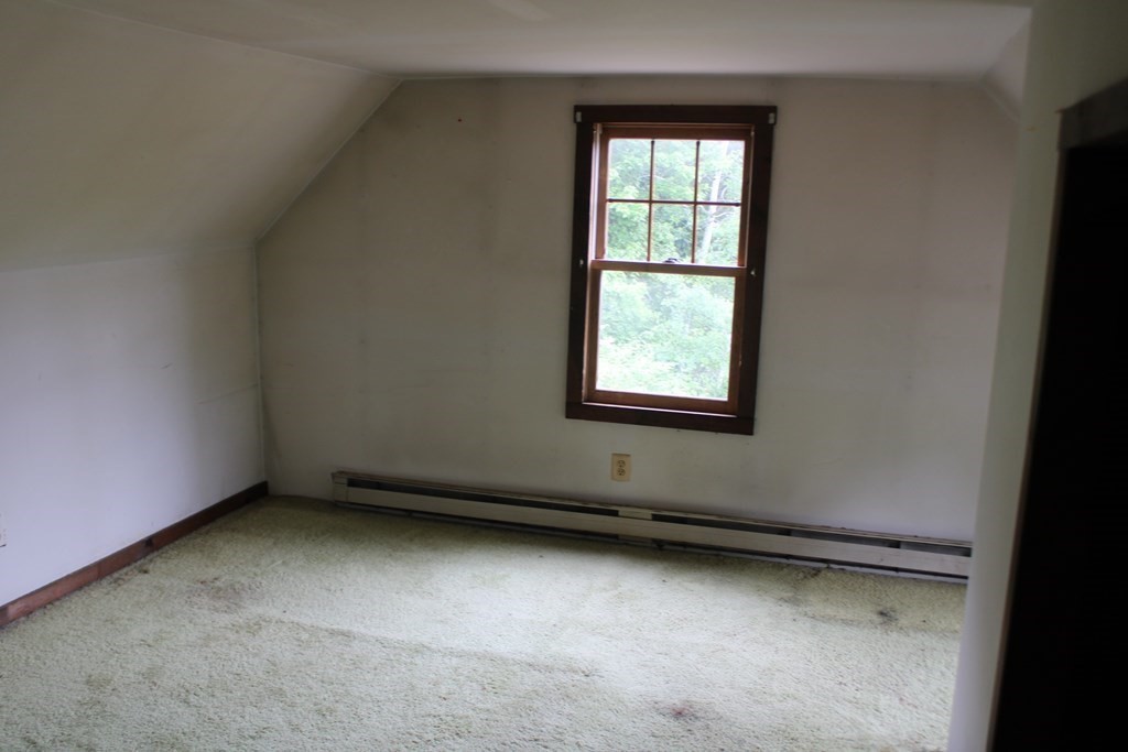 258 Plumtree Road Sunderland, MA 01375 - Photo 11 of 17 an empty room with a window