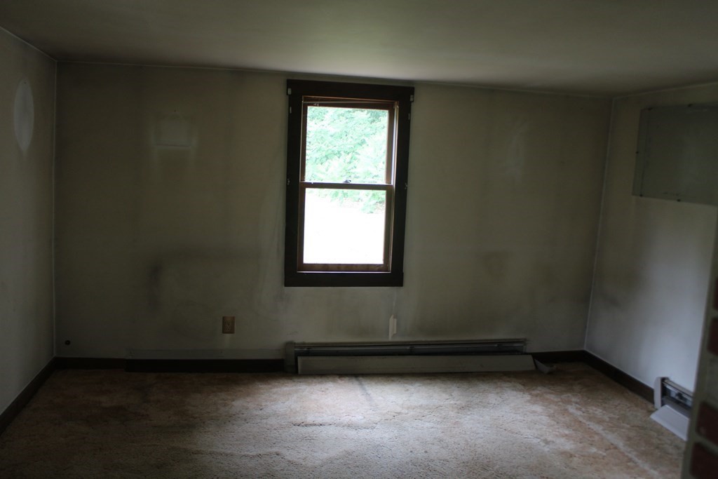 258 Plumtree Road Sunderland, MA 01375 - Photo 12 of 17 an empty room with a window