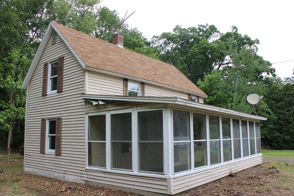 258 Plumtree Road Sunderland, MA 01375 - Photo 3 of 17 a view of a white house with a large windows