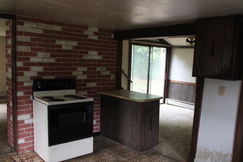 258 Plumtree Road Sunderland, MA 01375 - Photo 6 of 17 a kitchen with a stove and a refrigerator