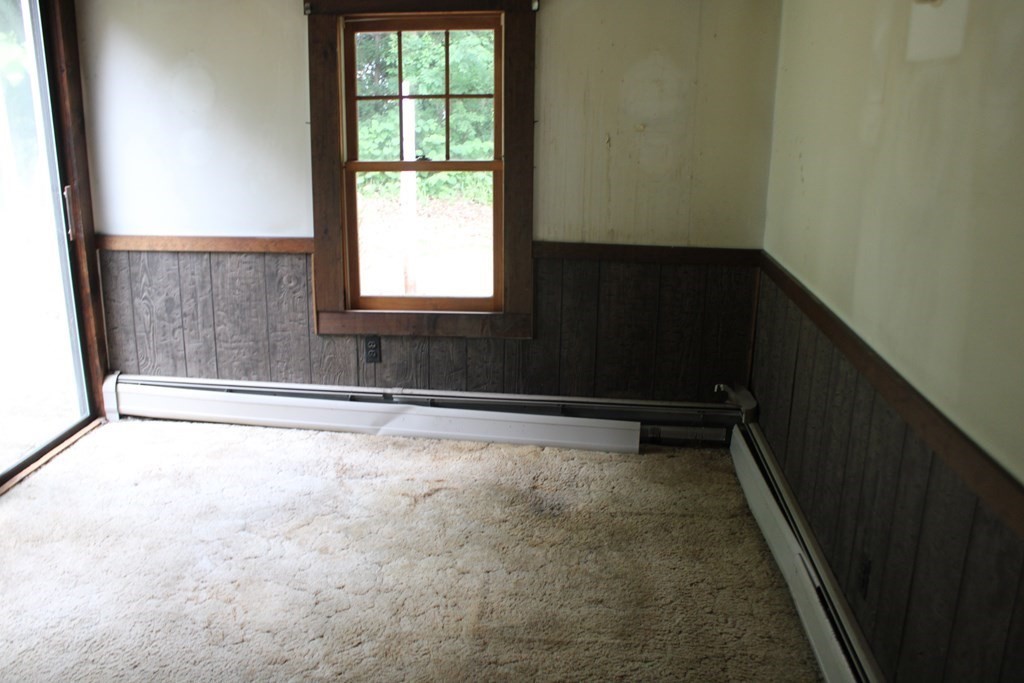 258 Plumtree Road Sunderland, MA 01375 - Photo 7 of 17 a view of an empty room with a window