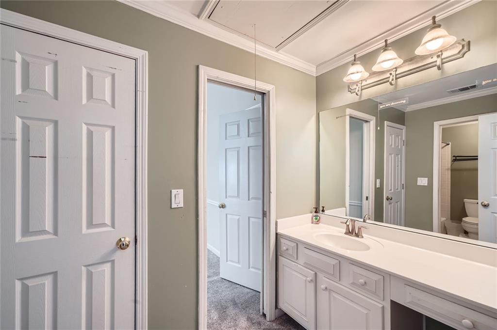 5106 Vining Estates Way Mableton, GA 30126 - Photo 16 of 28 a bathroom with a double vanity sink and a mirror