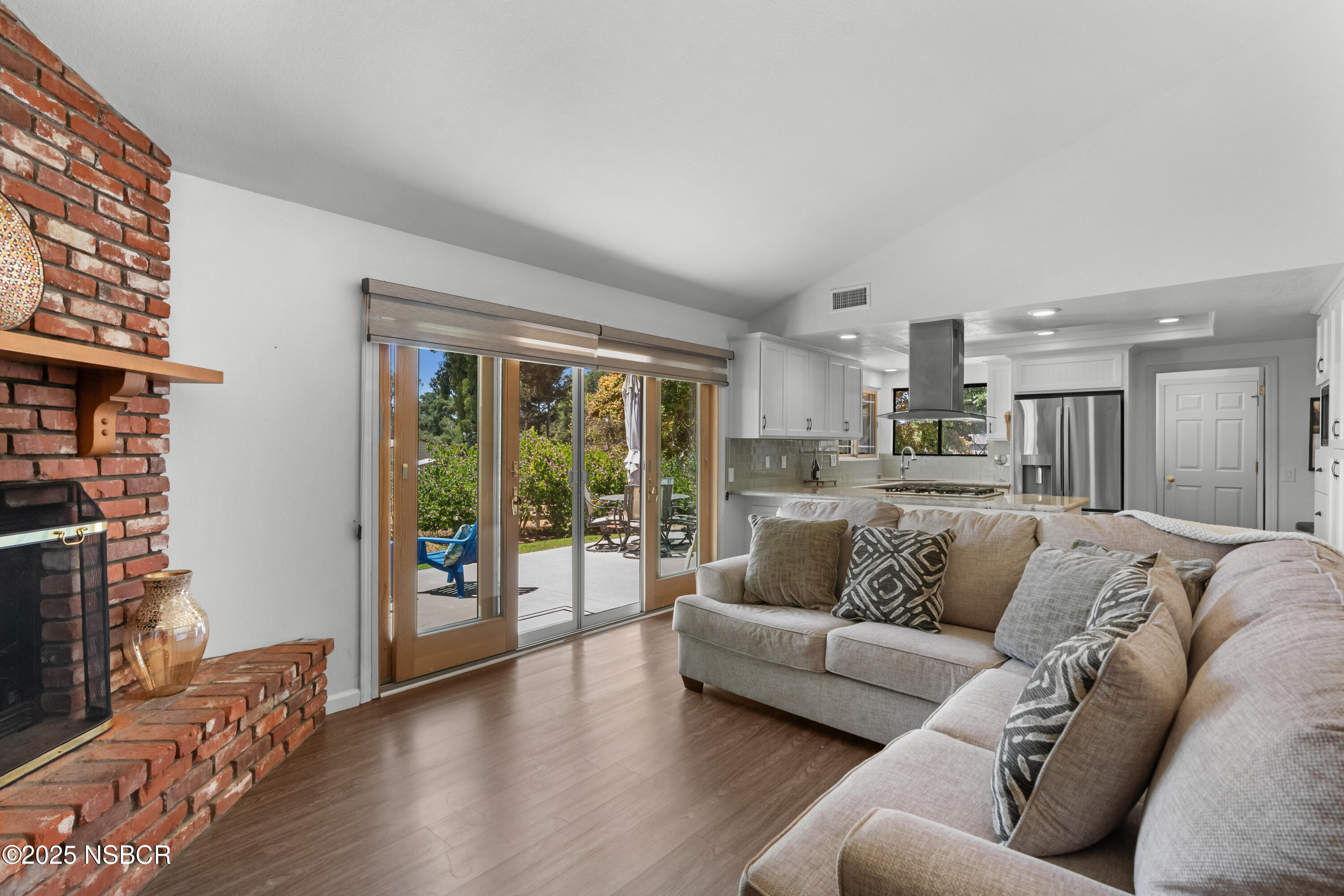181 Eucalyptus Road Nipomo, CA 93444 - Photo 14 of 36 a view of living room kitchen with furniture and wooden floor
